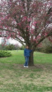 Mom by her flowering crabapple tree